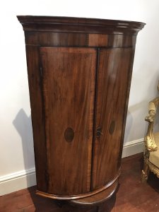 Period Antique 18Th Century George III Corner Cupboard Mahogany Corner Cupboard Cross Banded With Satinwood With Herringbone Inlays And Shell Motifs On The Bow Fronted Doors Ornate Cornice And Shaped Shelves Inside With 3 Oak Lined Drawers Original Lock And Key A Stunning Antique Investment Provenance Purchased From Stately Home In Shropshire Dimensions In Inches Height 42” Width 29” Depth 20.5”