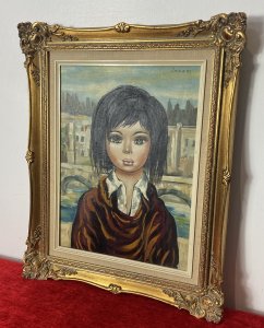 Italian Modern Caricature Style Oil Portrait Of Young Girl Signed SAGERI Circa - 20th Century Vintage Composition - Oil On Canvas Listing Description Beautiful And Interesting Composition Depicting The Half Portrait Of A Young Dark Haired Female, With Enlarged Cartoonist Features. The Females Head Is Disproportionate To The Body With Large Green Doll Like Eyes And Small Pursed Mouth. The Female Wears White Shirt With Elaborate Layered Over Robe. Focused Portrait With Unusual Impressionistic Venetian Landscape Background. A Stunning Conversation Artwork In Bold Colour Pallet. Signed by Artist SAGERI (Top Right Corner) And Set In Ornate Gilt Frame. Dimensions In Inches Height Width