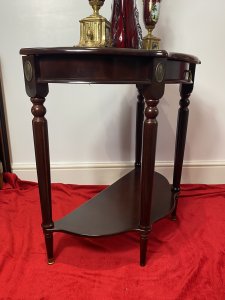 Vintage Regency Style Cherry Mahogany Demi-Lune Occasional Hall Table Circa - Vintage Composition - MDF Shell Overlaid With Cherry Mahogany Veneer Vintage Cherry Mahogany Demi Lune Occasional Hall Table In The Regency Style With Semi Circle Top And Pull Out Drawer With Brass Garland Handle For Storage Of Paperwork. Stands Upon Four Elegant Legs With Decorative Brass Floral Plaque Ornamentation With Brass Floor Mounts And Under Shelf For Ornament Display. Condition - Very Good Original A Couple Of Scratches To Top And One Of The Brass Foot Mounts Missing On Front Leg (Left Side). Please See Listing Images Dimensions In Inches Height 30" Width 31" Depth 15" Drawer Depth 2"