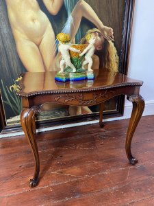 Stunning Elmwood Augustus Pugin Style Gothic Carved Centre Table. Finest Quality Craftsman Made Serpentine Shaped Carved Centre Table With Floral Carved Underside Panels & Egg Moulded Edges. Stands Upon Cabriole Legs. Made In Solid Dutch Elm Wood With Beautiful Patina. A Fine Heavy Quality Centre Table In The Style Of Master Craftsman Augustus Pugin. Stunning Reproduction Piece Condition- Lovely Used Small Scratch On The Top Please See Images Provenance Purchased From London Town House Mayfair, London. Now Part Of Lord Hill Collection Dimensions In Inches Height 23” Width 29” Depth 21”