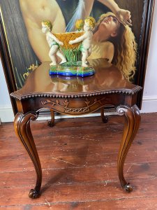 Stunning Elmwood Augustus Pugin Style Gothic Carved Centre Table. Finest Quality Craftsman Made Serpentine Shaped Carved Centre Table With Floral Carved Underside Panels & Egg Moulded Edges. Stands Upon Cabriole Legs. Made In Solid Dutch Elm Wood With Beautiful Patina. A Fine Heavy Quality Centre Table In The Style Of Master Craftsman Augustus Pugin. Stunning Reproduction Piece Condition- Lovely Used Small Scratch On The Top Please See Images Provenance Purchased From London Town House Mayfair, London. Now Part Of Lord Hill Collection Dimensions In Inches Height 23” Width 29” Depth 21”