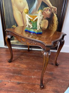 Stunning Elmwood Augustus Pugin Style Gothic Carved Centre Table. Finest Quality Craftsman Made Serpentine Shaped Carved Centre Table With Floral Carved Underside Panels & Egg Moulded Edges. Stands Upon Cabriole Legs. Made In Solid Dutch Elm Wood With Beautiful Patina. A Fine Heavy Quality Centre Table In The Style Of Master Craftsman Augustus Pugin. Stunning Reproduction Piece Condition- Lovely Used Small Scratch On The Top Please See Images Provenance Purchased From London Town House Mayfair, London. Now Part Of Lord Hill Collection Dimensions In Inches Height 23” Width 29” Depth 21”