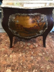 French Ormolu Louis VXI Style Bombé Commode Chest With Carrera Marble Top Circa - Vintage ReproductionComposition - Hard Wood With Brass Ormolu Listing Description Stunning Bombé Shaped French Louis XVI Style Commode Chest With Solid Carrera Marble Top, Hand Painted With Watteauesque Landscape Scenes. The Front Elevation Is Adorned With Hand Painted Romantic Landscape Scene, Depicting Two Arched Bridges Over Moat Leading To Large Castle Fortress. The Artwork Is Encased Inside A Rich Foliate Ormolu Boarder Over Two Pull Out Drawers With Elaborate Acanthus Handles And ormolu Banded Edges. Both Side Elevations Also Hand Painted With Flora And Forna Scenes Inside Ormolu Boarder. Set Upon Serpentine Shaped Legs With Ormolu Encrusted Feet. Dimensions In Inches Height 35"Width 38” Depth 22” Condition - Used Vintage Signs Of Wear To Paintwork Showing Small Scuffs & Chips Due To Age And Usage. For further information please call 07376619513