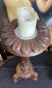 19th Century Large Pair Of Gothic Carved Walnut Tripod Candle Stands. Circa - 1865 Composition- Solid Walnut Condition- Lovely Used A Pair Of Solid Walnut Hand Carved Candles Stands With Shell Top Housing For Large Wax Candle With Decorative Pillar Enriched In Acanthus Leaf Motifs, Standing Upon Solid Tripod Plinth Bases. Beautiful Addition To Gothic Manor. Lovely For Next To An Elaborate Fireplace, Hallway Or Dining Area. Although These Are Being Sold As A Pair They Both Varies Slightly In Design. Please See Images Before Purchase. Provenance Purchased From Country Manor In The Scottish Highlands. Now Part Of Lord Hill Museum Private Collection. Dimensions In Inches Height 29.5” Top Housing Width 9” Tripod Base Width 10”