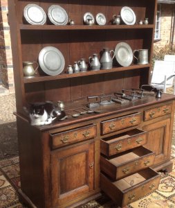 18th Century Oak Lancashire Dresser Cross Banded In Mahogany 6 Drawers With 2 Deep Cupboards With Internal Shelf On Bracket Pine Lined Drawers With Brass Drop Handles Shaped Feet Thick Original Oak Back Boards The Handles Have Been Replace Around 1980’s Please Note There Are Signs Of Shrinkage To The Top And Side Conducive To Age Charming Antique Investment For Country House Or Manor To Be Sold Complete With Collection Of Pewter Flagons Tankards And Hall Marked Plates Plus 6 Flt Irons With Interesting Brand Name Of The Period This Fine Dresser Came From A Manor House Near Lancashire Complete With 31 Object Pewter Collection Dimensions In Inches Top Height 42” Width 63” Base Height 33” Width 62” Depth 20”