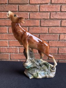 Rare Art Deco Lustreware Large Deer Figurine ByJema Holland Foundry Mold No25. Circa - 1930’s Composition- Lustre Glazed Ceramic Large Art Deco Ceramic Lustreware Figurine Of A Posed Calling Deer Set Upon Rock Face. Stunning Facial Details With Delicate Legs And Textural Base. Marked Underside Jema Holland No 25. The Jema Holland Foundry Was Founded In 1942 And Ceased To Trade In 1994. This Is Thought To Be An Early Piece. Condition- Pristine Antique There Are Two Holes In The Head Were Horns Once Stood. Dimensions In inches Height 17” Width 10” Depth 5.5”