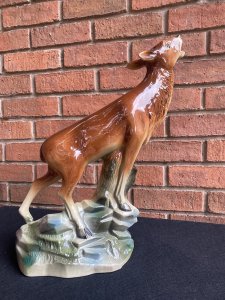 Rare Art Deco Lustreware Large Deer Figurine ByJema Holland Foundry Mold No25. Circa - 1930’s Composition- Lustre Glazed Ceramic Large Art Deco Ceramic Lustreware Figurine Of A Posed Calling Deer Set Upon Rock Face. Stunning Facial Details With Delicate Legs And Textural Base. Marked Underside Jema Holland No 25. The Jema Holland Foundry Was Founded In 1942 And Ceased To Trade In 1994. This Is Thought To Be An Early Piece. Condition- Pristine Antique There Are Two Holes In The Head Were Horns Once Stood. Dimensions In inches Height 17” Width 10” Depth 5.5”