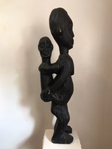 Museum Grade African Primitive Congo Style Wood Carving Mother And Child Antique Large Size Wood Carving Of Mother And Child Perched On The Mother’s Back. Primitive Carved Body Shapes With Facial Expressions And Markings Of Hands And Feet. A Solid Sculpture Carved In In Piece Of Hard Wood. Original Condition With Ancient Cracks And Imperfections Due To Age. Provenance Original Owner Brought The Carving Back From African Coast During 1820’s Purchased By The Lord Hill Museum And Part Of A Large Collection Of African Sculpture Dimensions In Inches Height 28.5” Width 6.5” Depth 7.5” Weight Approx 15Kg