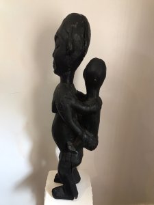 Museum Grade African Primitive Congo Style Wood Carving Mother And Child Antique Large Size Wood Carving Of Mother And Child Perched On The Mother’s Back. Primitive Carved Body Shapes With Facial Expressions And Markings Of Hands And Feet. A Solid Sculpture Carved In In Piece Of Hard Wood. Original Condition With Ancient Cracks And Imperfections Due To Age. Provenance Original Owner Brought The Carving Back From African Coast During 1820’s Purchased By The Lord Hill Museum And Part Of A Large Collection Of African Sculpture Dimensions In Inches Height 28.5” Width 6.5” Depth 7.5” Weight Approx 15Kg