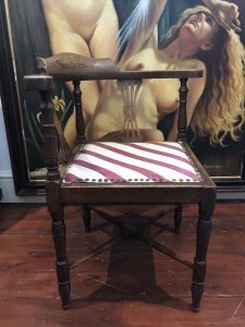 Victorian Sheritan Inlaid Corner Armchair Cartouche Shaped Top With Marquetry Inlaid Folate Leaves Back Splats Inlaid With Urns And Flowers Turned Legs And Stretchers Original Condition With Striped Red Silk Upholstery With Brass Stud Fixings Signs Of Wear Due To Age Circa 1885 Dimensions In Inches Back Height 31” Width 16.5” Depth 23” Seat Height From Floor 19”