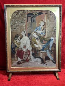 Period Oak Firescreen With Georgian Family Portrait Silkwork Tapestry Sampler Circa - 1830 Composition - Oak Frame/ Silk Work Needle Point Tapestry Listing Description Elegant Egg And Dart Carved Oak Framed Rectangular Fire Screen With Glazed Central Viewing Window With Silk Work Needle Point Tapestry. Tapestry Showcasing Georgian Family Portrait Scene Outside The Doorway Of Their Home With Four Figures Two Female & Two Male. Left Female (In Gold Gown) Sits With Hand Resting Against Her Head, Her Mother Sits Next To Her With Sheep Dog Waiting, A Young Male Leans Back Into His Chair Gazing At The Female Whilst Male Behind Him Stares Toward The Viewer. Lovely Details With Stonework And Ornate Country Oak Door With View Of Interior Through The Doorway. Stands Upon Slender Feet. Beautiful Quality Artwork For Room Display Or Use As Fire Cover When Not In Use. Dimensions In Inches Height 34" X Width 26.5" X Depth 9 3/4" (at base)