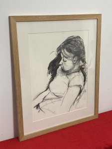 Figurative Charcoal Sketch Of Young Lady In Deep Thought By Michael Jenkins. Beautiful Hand Drawn Still Life Portrait In Charcoal Of A Young Lady Gazing To The Floor In Deep Thought. Stunning Movement And Shadows. Set In A Boarded In A Pine Frame. Signed By Artist (Right Corner) Dimensions In Inches Height 20.5” Width 16.5”