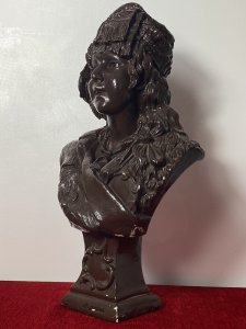 Large French Art Deco Classical Bohemian Gypsy Woman Chalk-ware Bust Circa - 1930's Composition - Overpainted Chalkware Art Deco Detailed Bust Of Bohemian Gypsy Woman With Elaborate Headdress Embellished With Coins And Tassels. Long Platted Hair With Large Bow, Oversized Segmented Necklace With Pendant And Tambourine Inside Her Jacket Pocket. Facial Feature In Fabulous Detail With Large Eyes And Beaming Smile. Standing On Tapered Classical Plinth With Scroll Decoration. Condition - Antique Used Overall Lovely. Signs Of Wear Smalls Scuffs To Paintwork Due To Age. Dimensions In Inches Height 19.5" Width 10" Depth 7" Base 4 1/2" X 4 1/4"