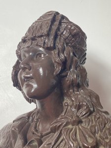 Large French Art Deco Classical Bohemian Gypsy Woman Chalk-ware Bust Circa - 1930's Composition - Overpainted Chalkware Art Deco Detailed Bust Of Bohemian Gypsy Woman With Elaborate Headdress Embellished With Coins And Tassels. Long Platted Hair With Large Bow, Oversized Segmented Necklace With Pendant And Tambourine Inside Her Jacket Pocket. Facial Feature In Fabulous Detail With Large Eyes And Beaming Smile. Standing On Tapered Classical Plinth With Scroll Decoration. Condition - Antique Used Overall Lovely. Signs Of Wear Smalls Scuffs To Paintwork Due To Age. Dimensions In Inches Height 19.5" Width 10" Depth 7" Base 4 1/2" X 4 1/4"