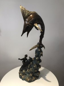 Vintage 20th Century Quality Bronze Statue Merlin Fish & Fishing Boat Capsized With Gilded Rock Supporting The Elaborate Merlin Fish On The Top Showpiece Excellent Detail To The Sculpture Fisherman’s Face Impeccably Executed Wonderful Collectors Rare Statement Antique Look Bronze Statue Signed By Artist On Side Of Fishing Boat Weight Approx 15Kg Dimension In Inches Height 34” Width 15” Depth 11”