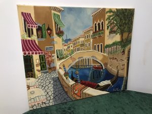 Contemporary Artwork Venician Villas With Gondolas Oil On Canvas By Paul Evans Exciting Painting With Brightly Coloured Villas And Waterway With Tethered Gondolas. Sign Points To San Marco Square Interesting Subject Painted In Great Detail Signed By Artist Paul Evans From Tipton West Midlands Unframed Dimensions In Inches Height 20” Width 23.5”