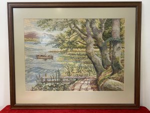 Hand Woven Lake Windermere Landscape Tapestry With Fisherman In Rowing Boat Circa - 20th Century Vintage Composition - Wool Work Intricate Woodwork Tapestry With Stunning Lake View Showing Fisherman Patiently Sitting In A Rowing Boat With His Fishing Rod Perched. The Lake Surrounded By Reeds, Lilly Pads And Water Daisies With Narrow Track To The Right With Detailed Trees And Jetty. Lovely Charming Subject With Stunning Perspective In A Array Of Vibrant Yellow, Green, And Blue Hues. Lake Scene Thought To Be At Lake Windermere. Framed / Unsigned Dimension In Inches Height 25.5" Width 31 1/4"