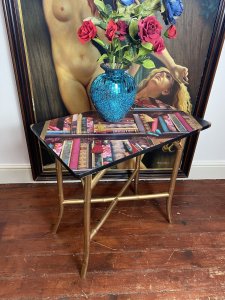 Contemporary Library Montage Hall Table With Bamboo X Frame Stretcher Circa - Vintage Composition - SoftWood Top With Bamboo Stand Beautiful Rectangular Hall Table With Brightly Coloured Bespoke Library Book Montage Decorative Top In Fuchsia, Cobalt Blue, Red & Gold. An Elegant Oriental Style Base In Gilt Bamboo With X Frame Stretcher Support. Stunning Showpiece For Eclectic Interior An Eye Catching Ornamental Display. Dimensions In Inches Height 29" Width 30" Depth 18" Weight Approx 15 KG