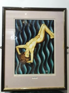 Contemporary Signed Proof 1/200 Titled Wavy Navy Nude Portrait By Malcolm Morris Title - Wavy Navy Artist - Malcolm Morris Signed Lithograph Of Original Contemporary Watercolour Nude Painting By Artist Malcolm Morris Proof Number 1 Of 200 By Renowned Welsh Artist Contemporary Unusual Wavy Background In Vivid Blue Hues With Posed Nude Muse With Fine Detail Very Well Executed Nude Lithograph Portrait Set In Glazed Wooden Frame Dimensions In Inches Height 24” Width 18.5”