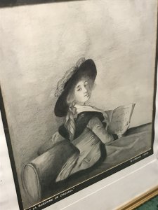 20th Century Artwork De La Barrone De Crussol Pencil And Charcoal Drawing Signed By Artist Elizabeth E Cooke and Dated 1978 Original Artwork In The Musee De Augustins Toulouse Original Artwork Dated 1785 Painted By Elizabeth Louise Vigèe Le Brun ( Famous Painter Of The Period Whom Also Painted Marie Antoinette) Pencil And Charcoal Half Portrait Drawing Of The Barrone De Crussol Florensac Whom Turns To Gaze The Viewer Over Her Shoulder. She Holds A Musical Score And Wears A Splendid Red Costume With Deep Black Velvet Collar And Matching Hat (Original In Colour) Little Is Known Of This Woman Of Great Beauty, Elegance And Distinction. Stunning Pencil And Charcoal Drawing Signed By Artist E A Cooke Set In Glazed Gilt Frame Dimensions In Inches Height 21 1/4” Width 17 1/4” Depth 1/2”