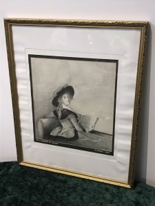 20th Century Artwork De La Barrone De Crussol Pencil And Charcoal Drawing Signed By Artist Elizabeth E Cooke and Dated 1978 Original Artwork In The Musee De Augustins Toulouse Original Artwork Dated 1785 Painted By Elizabeth Louise Vigèe Le Brun ( Famous Painter Of The Period Whom Also Painted Marie Antoinette) Pencil And Charcoal Half Portrait Drawing Of The Barrone De Crussol Florensac Whom Turns To Gaze The Viewer Over Her Shoulder. She Holds A Musical Score And Wears A Splendid Red Costume With Deep Black Velvet Collar And Matching Hat (Original In Colour) Little Is Known Of This Woman Of Great Beauty, Elegance And Distinction. Stunning Pencil And Charcoal Drawing Signed By Artist E A Cooke Set In Glazed Gilt Frame Dimensions In Inches Height 21 1/4” Width 17 1/4” Depth 1/2”