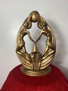 Rare French Empire 1930’s Art Deco Gilt Mascot Sculpture Of Two Nude Nymphs. Breathtaking Design Of The Period Theatrical Posed Pair Of Nude Nymphs Giving The Ultimate Image Of Glamour. Fabulous Shaped Art Deco Period Gilt Designer Sculpture. Beautiful And Iconic Conversation Piece. Provenance Purchased From Nobleman Collector Of Fashion In Paris Now Part Of Extensive Lord Hill Collection Dimensions In Inches Height 19” Width 12” Depth 6”