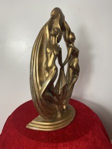 Rare French Empire 1930’s Art Deco Gilt Mascot Sculpture Of Two Nude Nymphs. Breathtaking Design Of The Period Theatrical Posed Pair Of Nude Nymphs Giving The Ultimate Image Of Glamour. Fabulous Shaped Art Deco Period Gilt Designer Sculpture. Beautiful And Iconic Conversation Piece. Provenance Purchased From Nobleman Collector Of Fashion In Paris Now Part Of Extensive Lord Hill Collection Dimensions In Inches Height 19” Width 12” Depth 6”
