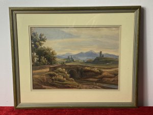 19C Aristocratic Romantic Castle Landscape Watercolour Painting By Lady Buetiau Hepburne. Circa - 1900 Composition - Watercolour On Velum Beautiful Watercolour Of A Romantic Landscape Composition Of Rolling Hills, Castles And Bridge Crossing In Italy With Detailed Flora And Forna. Impressive Coloration In Earth Hues Painted By The Fine Hand Of Aristocrat Lady Buetiau Hepburne Whilst On Vacation In Italy During The 1900. Signed On The Reverse And Set In Glazed Gilt Frame. Dimensions In Inches Height 13 1/4” Width 17 1/4”