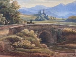 19C Aristocratic Romantic Castle Landscape Watercolour Painting By Lady Buetiau Hepburne. Circa - 1900 Composition - Watercolour On Velum Beautiful Watercolour Of A Romantic Landscape Composition Of Rolling Hills, Castles And Bridge Crossing In Italy With Detailed Flora And Forna. Impressive Coloration In Earth Hues Painted By The Fine Hand Of Aristocrat Lady Buetiau Hepburne Whilst On Vacation In Italy During The 1900. Signed On The Reverse And Set In Glazed Gilt Frame. Dimensions In Inches Height 13 1/4” Width 17 1/4”