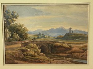 19C Aristocratic Romantic Castle Landscape Watercolour Painting By Lady Buetiau Hepburne. Circa - 1900 Composition - Watercolour On Velum Beautiful Watercolour Of A Romantic Landscape Composition Of Rolling Hills, Castles And Bridge Crossing In Italy With Detailed Flora And Forna. Impressive Coloration In Earth Hues Painted By The Fine Hand Of Aristocrat Lady Buetiau Hepburne Whilst On Vacation In Italy During The 1900. Signed On The Reverse And Set In Glazed Gilt Frame. Dimensions In Inches Height 13 1/4” Width 17 1/4”