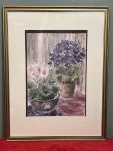 20th Century Botanical Still Life Watercolour Painting By Artist Lorna Watson Circa - 1970 Composition - Watercolour on Vellum Listing Description Feminine Botanical Still Life Arrangement Showcasing Two Potted Floral Plants. (Nearest) Pastel Pink Cyclamen In Ornate Chinese Painted Bowl And Behind Blooming Violet In Circular Clay Garden Pot. Whole Artwork In Array Of Rich Pinks And Purple Hues. Flowers Foliage In Fine Detail. Stunning Artwork For Bright Wall Hanging Display. Signed By Artist (Right Bottom Corner) Lorna Watson And Set in Double Bordered Gilded Glazed Frame. Dimensions In Inches Height 23.5" X Width 18"