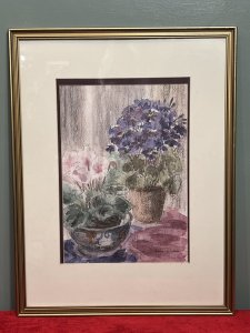 20th Century Botanical Still Life Watercolour Painting By Artist Lorna Watson Circa - 1970 Composition - Watercolour on Vellum Listing Description Feminine Botanical Still Life Arrangement Showcasing Two Potted Floral Plants. (Nearest) Pastel Pink Cyclamen In Ornate Chinese Painted Bowl And Behind Blooming Violet In Circular Clay Garden Pot. Whole Artwork In Array Of Rich Pinks And Purple Hues. Flowers Foliage In Fine Detail. Stunning Artwork For Bright Wall Hanging Display. Signed By Artist (Right Bottom Corner) Lorna Watson And Set in Double Bordered Gilded Glazed Frame. Dimensions In Inches Height 23.5" X Width 18"