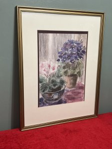 20th Century Botanical Still Life Watercolour Painting By Artist Lorna Watson Circa - 1970 Composition - Watercolour on Vellum Listing Description Feminine Botanical Still Life Arrangement Showcasing Two Potted Floral Plants. (Nearest) Pastel Pink Cyclamen In Ornate Chinese Painted Bowl And Behind Blooming Violet In Circular Clay Garden Pot. Whole Artwork In Array Of Rich Pinks And Purple Hues. Flowers Foliage In Fine Detail. Stunning Artwork For Bright Wall Hanging Display. Signed By Artist (Right Bottom Corner) Lorna Watson And Set in Double Bordered Gilded Glazed Frame. Dimensions In Inches Height 23.5" X Width 18"