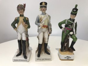 3 Porcelain French Cavelry Officer Figurines Named Figurines 1. Soldat d’Infanteria 2. Officer Rifle Brigade 1815 3. Officer des chasseurs Handmade In French Factory Dated 1930’s Dimensions In Inches 1 H 8.5” W 2.5” 2 H 8.1/4” W 2.1/4” 3 H 8.3/4” W 2.5”