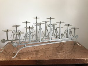 Pair Of Ornate Wrought Iron 7 Branch Candelabras 7 Tiered Candle Holders With Spikes To Secure The Candles As Well As Wax Trays Ornate Wrought Iron Scrolls With Twisted Iron Decorative Spiral Supports With Organic Leaf Ends The Candelabras Stand On Four Ornate Legs Beautiful Vintage Paint Effect Turquoise/Cream Dimensions In Inches Approx Height at highest point 15” Height At Ends 9.5” Width 34” Depth 4”