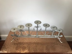 Pair Of Ornate Wrought Iron 7 Branch Candelabras 7 Tiered Candle Holders With Spikes To Secure The Candles As Well As Wax Trays Ornate Wrought Iron Scrolls With Twisted Iron Decorative Spiral Supports With Organic Leaf Ends The Candelabras Stand On Four Ornate Legs Beautiful Vintage Paint Effect Turquoise/Cream Dimensions In Inches Approx Height at highest point 15” Height At Ends 9.5” Width 34” Depth 4”