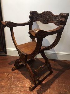 Carved Red Walnut X Frame Green Man Great Hall Chair Hand Carved In Solid Red Walnut Wood With Green Man Face Carvings, Griffins Head Arm Rests And Floral Motifs Carved Arched Stretchers Stunning Quality X Frame Hall Chair Lovely Condition Dimensions In Inches Height 36.5 Seat Height 17” Width 24.5” Depth 20”