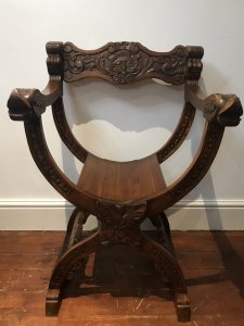Carved Red Walnut X Frame Green Man Great Hall Chair Hand Carved In Solid Red Walnut Wood With Green Man Face Carvings, Griffins Head Arm Rests And Floral Motifs Carved Arched Stretchers Stunning Quality X Frame Hall Chair Lovely Condition Dimensions In Inches Height 36.5 Seat Height 17” Width 24.5” Depth 20”