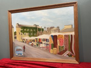British Contemporary Art ' Market Day Kirby Lonsdale' Oil Painting Title - Market Day, Kirby Lonsdale Artist - Lawrence Crane Listing Description Vibrant Contemporary Artwork Of Kirby Lonsdales Market Charter Started In 1227. Originally Located At The Corner Of The Main Street And Market Street Before Being Located To The Towns Elegant Georgian Square, Overlooked At One End by The Royal Hotel, Made Famous By A Visit By Queen Adelaide in 1840, And The Other End By The Old Bank. Monument At The centre Of The Square Was Built In 1903 And Originally Had A Gothic Pinnacle Top Which Was Removed In The 1940s With Fear Of Structural Integrity. Wonderful Artwork With Architectural Merit Showcases Street View Of Bustling Market With Stall Holders Selling Lavishly Colour Blocked Goods, Including Clothing And Carpets. Top View Of Famous Historical Monument And Ivy Covered 'The Royal Hotel'. Signed By Artist And Set In Oak Frame. Dimensions In Cm Height 50.5cm x Width 66cm