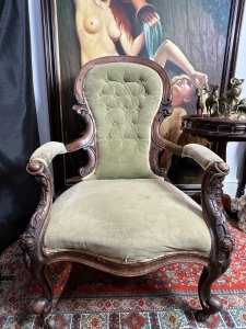 Title - Antique Victorian Balloon Back Armchair Circa 1870 Circa - 1870 Composition - Walnut Frame / Silk Velvet Upholstery -Listing Description - Stunning Antique Balloon Back Armchair With Solid Walnut Frame Ornately Carved With Rose vines And Acanthus Leaves. Elegantly Shaped Deep Buttoned Back Rest In Victorian Balloon Back Shape With Wide Comfortable Seat And Splayed Cushioned Armrests. Cabriole Front Legs With Castors For Ease Of Movement And Splayed Back Legs. Original Silk Velvet Upholstery In Good Order. Showing Expected Signs Of Wear And Colour Fade Due To Age And Usage. Wonderful Fine Quality Armchair For Relaxation In County Setting. Could Be Reupholstered To Fit Into A More Modern Setting. Dimensions In Inches Back Rest Height 38.5" X Seat Height 14" X Width26.5" X Depth 32" For Further information Please Call 07376618513 Thank-you