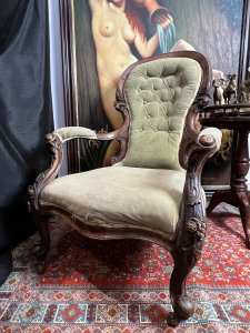 Title - Antique Victorian Balloon Back Armchair Circa 1870 Circa - 1870 Composition - Walnut Frame / Silk Velvet Upholstery -Listing Description - Stunning Antique Balloon Back Armchair With Solid Walnut Frame Ornately Carved With Rose vines And Acanthus Leaves. Elegantly Shaped Deep Buttoned Back Rest In Victorian Balloon Back Shape With Wide Comfortable Seat And Splayed Cushioned Armrests. Cabriole Front Legs With Castors For Ease Of Movement And Splayed Back Legs. Original Silk Velvet Upholstery In Good Order. Showing Expected Signs Of Wear And Colour Fade Due To Age And Usage. Wonderful Fine Quality Armchair For Relaxation In County Setting. Could Be Reupholstered To Fit Into A More Modern Setting. Dimensions In Inches Back Rest Height 38.5" X Seat Height 14" X Width26.5" X Depth 32" For Further information Please Call 07376618513 Thank-you