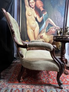 Title - Antique Victorian Balloon Back Armchair Circa 1870 Circa - 1870 Composition - Walnut Frame / Silk Velvet Upholstery -Listing Description - Stunning Antique Balloon Back Armchair With Solid Walnut Frame Ornately Carved With Rose vines And Acanthus Leaves. Elegantly Shaped Deep Buttoned Back Rest In Victorian Balloon Back Shape With Wide Comfortable Seat And Splayed Cushioned Armrests. Cabriole Front Legs With Castors For Ease Of Movement And Splayed Back Legs. Original Silk Velvet Upholstery In Good Order. Showing Expected Signs Of Wear And Colour Fade Due To Age And Usage. Wonderful Fine Quality Armchair For Relaxation In County Setting. Could Be Reupholstered To Fit Into A More Modern Setting. Dimensions In Inches Back Rest Height 38.5" X Seat Height 14" X Width26.5" X Depth 32" For Further information Please Call 07376618513 Thank-you