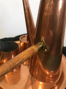 Vintage Arts And Crafts Conical Shaped Copper 4 Pcs Coffee Set By ARGY Europe 4 Piece Set Includes Conical Shaped Coffee Pot, Cream Jug And Lidded Sugar Basin With Teak Handles Sitting On Copper Circular Tray Unique Stylish Design Composition - Copper Outer With Tin Lining Condition- Used Good Circa - 1930’s Signs Of Wear Small Dents And Scratches Dow To Age And Usage Dimensions In Inches Tray Diameter 10.5” Coffee pot height 9.5” Width 3.5” Sugar Basin Height 4” Width 2 3/4” Cream Jug Height 2.5” Width 2.5”