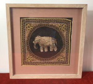 Beautiful Indian Applique Tapestry Of Elephant In Bleaches Oak Box Frame. Hand Woven Silks And Hessian Thread Tapestry Of A Centralised Elephant In Black Circular Boarder With Contrasting Decorative Boarders Surrounding In Delicate Glass Bread Work, Sequins And Decorative Embroidery Stitch Work. Set In Fine Bleached Oak Frame. Beautiful Hand Woven Tapestry And Appliqué Work. Elephants In Hinduism And The Indian Culture A re Simnolic Of Intellectual And Earthly Mental Strength.It Is A Sacred Animal And Is Considered The Representation Or Living Incarnation Of Ganesha, The Elephant Headed Deity Rising A Mouse. Originally From Calcutta. Collectors Piece Dimensions In Inches Height Width Depth
