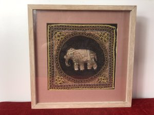 Beautiful Indian Applique Tapestry Of Elephant In Bleaches Oak Box Frame. Hand Woven Silks And Hessian Thread Tapestry Of A Centralised Elephant In Black Circular Boarder With Contrasting Decorative Boarders Surrounding In Delicate Glass Bread Work, Sequins And Decorative Embroidery Stitch Work. Set In Fine Bleached Oak Frame. Beautiful Hand Woven Tapestry And Appliqué Work. Elephants In Hinduism And The Indian Culture A re Simnolic Of Intellectual And Earthly Mental Strength.It Is A Sacred Animal And Is Considered The Representation Or Living Incarnation Of Ganesha, The Elephant Headed Deity Rising A Mouse. Originally From Calcutta. Collectors Piece Dimensions In Inches Height Width Depth