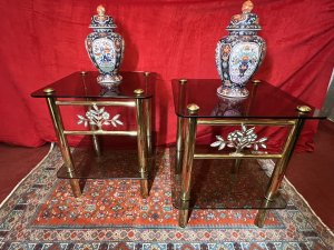 Pair Of Italian Designer Brass Maritime Side Tables With Pearl Inlaid Bouquets. Circa - 1980 Composition - Polished Brass With Smoked Glass Listing Description Pair Of Impressive Italian Designer Polished Brass Maritime Side/Occasional Tables. Square Shape With Smoke Glass Tops And Under Shelves For Storage & Ornament Display. Showcasing Elaborate Front Facing Mother Of Pearl Inlaid Motif Bouquets And Set Upon Four Cylindrical Column Legs. Condition- Excellent Used Minor Scratches Visible to Glass Surface Due To Age And Usage. Dimensions In Inches Height 22” Width 18” SQ