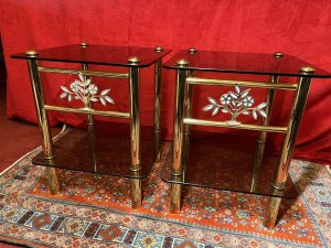 Pair Of Italian Designer Brass Maritime Side Tables With Pearl Inlaid Bouquets. Circa - 1980 Composition - Polished Brass With Smoked Glass Listing Description Pair Of Impressive Italian Designer Polished Brass Maritime Side/Occasional Tables. Square Shape With Smoke Glass Tops And Under Shelves For Storage & Ornament Display. Showcasing Elaborate Front Facing Mother Of Pearl Inlaid Motif Bouquets And Set Upon Four Cylindrical Column Legs. Condition- Excellent Used Minor Scratches Visible to Glass Surface Due To Age And Usage. Dimensions In Inches Height 22” Width 18” SQ