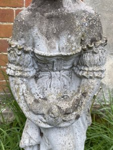 Andromeda Grecian Goddess Holding Turtle Dove Vintage Garden Sculpture. Circa - Vintage Composition- Reconstituted Stone Stunning Grecian Beauty Dressed In Elaborate Off The Shoulder Tiered Gown Holding Turtle Dove. Detailed Gown With Frills, Ribbons And Bows. Goddess With Delicate Facial Features Standing Upon Circular Plinth Base Decorated With Roses. Provenance Purchased From Port Elliot, Lisgaurd Cornwall. Dimensions In Cms Height 83cm Width 27cm Depth 27cm