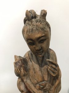 Two Oriental Fruitwood Carvings One Female With Fine Carved Robe Details Holding Flowers One Large Male Carving With Unusual Long Carved Hair And Flowing Robe Origin Unknown Presumed To Be Chinese Collectors Items Dimensions In Inches Male Height 15” Width 4” Female Height 12” Width 3.5”