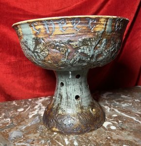 Large Cornish Studio Pottery 'Good Cheer Upon This House' Fruit Bowl Circa - 1970 Composition - Earthenware Listing Description Large Ornamental Studio Pottery Fruit Bowl On Stand. Top Bowl For Holding Fruit Or Decorative Items, Shaped Like A Spherical Cap And Set Upon Tapered Base With Circular Vent Holes. Wonderful Hand Etched Pattern Of Oak Leaves With Entwined Majestical Flowers, With The Top Edge Of The Bowl Reading 'Good Cheer Upon This House' In Scripture Style Text. Fruit Bowl Finished With Rich Kiln Sage Green And Brown Glaze. A Interesting And Very Useful Piece In Pristine Condition. Dimensions in Inches Height 11" X Top Diam 12" For Further Information Please Call The Curator On 07707 488 566 Thank-you.